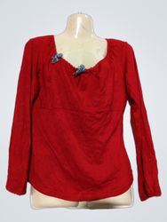 Red long-sleeve top with decorative bows