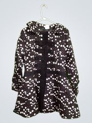 Black and white polka dot coat with "STYLE" tag