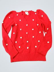 Roter V-Ausschnitt-Pullover mit weißen Pom Pons un..