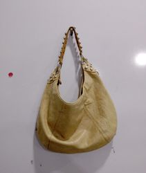 Beige studded hobo bag