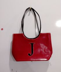 Red handbag with letter J