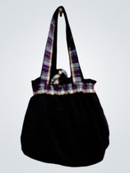 Black drawstring bag with plaid accents