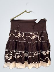 Brown skirt with white floral embellishments