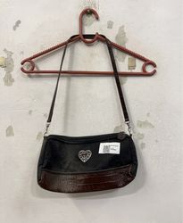 Black handbag with heart detail and brown trim