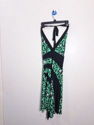 Green and black halter neck dress with floral patt..