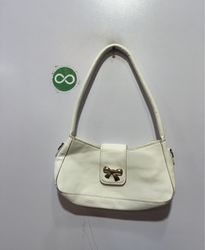 White shoulder bag with gold bow detail