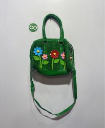 Green handbag with flower appliques