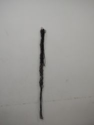 Black String Hanging on Wall