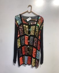 Black sweater with colorful sequin embellishments