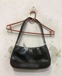 Black shoulder bag with a small metal logo