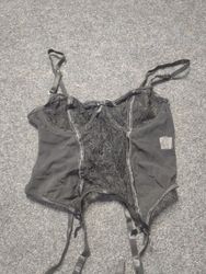 Black lace and mesh corset with garter straps