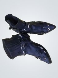 Black Pointed Toe Boots with Decorative Accents