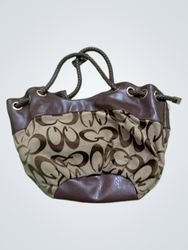 Brown and tan drawstring bucket bag