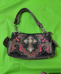 Black handbag with ornate cross embellishment