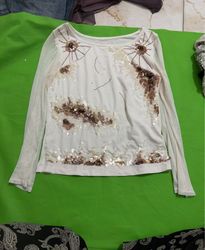 White long-sleeve top with sequins and embellishme..