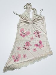 White halter top with butterfly and floral embelli..