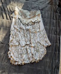 White skirt with sequin and fringe embellishments