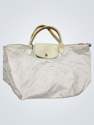 White handbag with beige leather accents