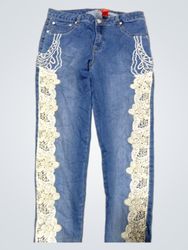 Blue denim jeans with white lace and embroidery