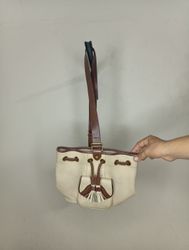 Dooney & Bourke Cream Leather Bucket Bag with Tass..
