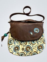 Brown and patterned crossbody bag with tassel