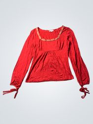 Red long sleeve top with tie detail