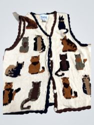 Cream knitted vest with assorted cat patterns and ..