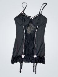 Black babydoll lingerie with pink bows and garters