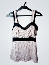 Pink camisole with black lace trim and black band