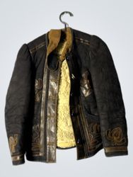 Black jacket with brown leather trim and shearling..
