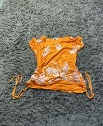 Orange T-shirt with white floral pattern
