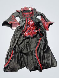 Black dress with red and black patterned sleeves a..