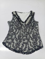 Sleeveless lace top with ruffled neckline