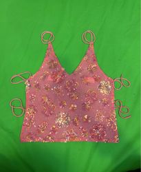 Top in paillettes rosa riciclato con motivo florea..