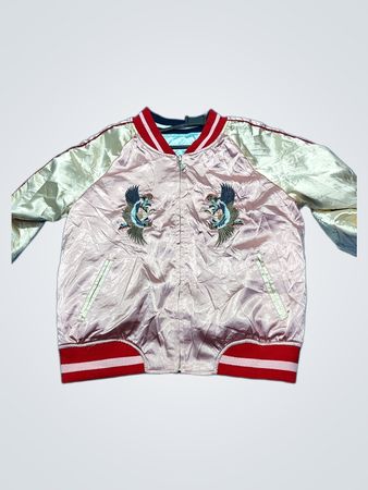 Pink bomber jacket with embroidered cranes and tiger