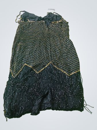Black dress with gold zigzag pattern and fringe