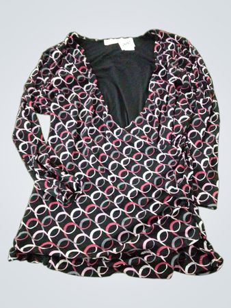 Black long sleeve wrap top with pink and grey interlocking circles pattern
