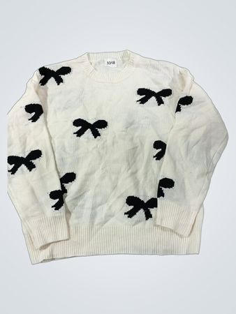 Weißer Pullover mit schwarzem Schleifenmuster