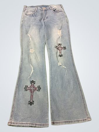 Hellblaue Flared-Jeans mit Kreuzstickerei und Rissen