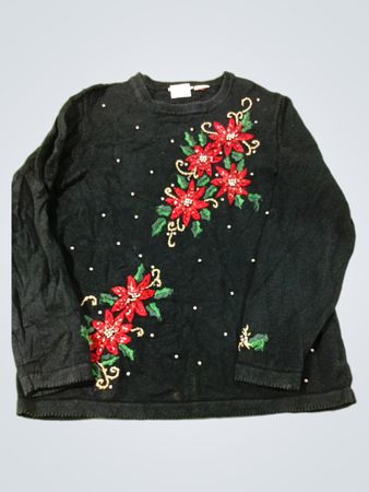 Schwarzer Pullover mit Weihnachtsstern- und Perlenverzierungen