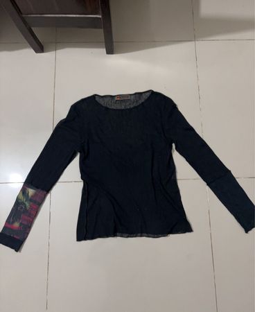 Black long sleeve mesh shirt with graphic print on sleeves