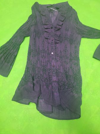Purple long-sleeved ruffled blouse with lace pattern