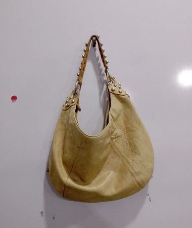 Beige studded hobo bag