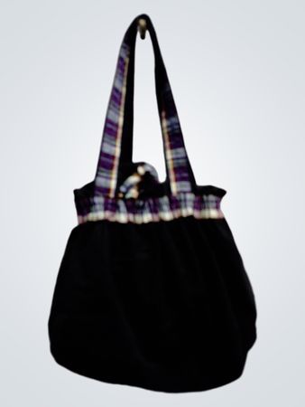 Black drawstring bag with plaid accents