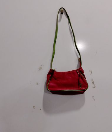 Red shoulder bag with green trim