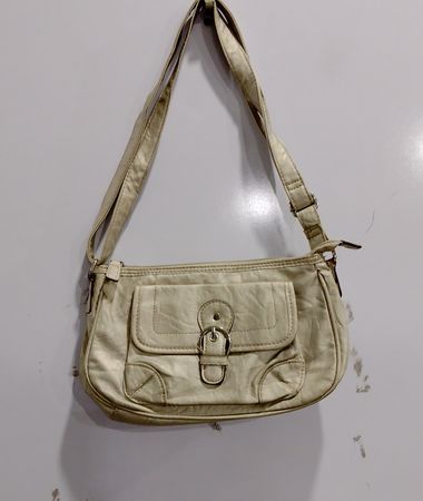 Beige shoulder bag with buckle detail