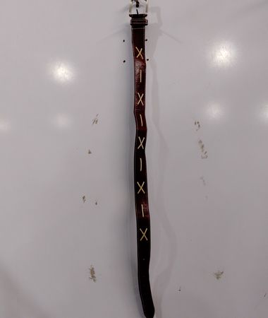 Brown leather belt with gold buckle and decorative stitching