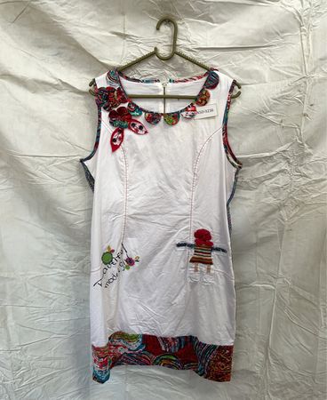 White Sleeveless Dress with Floral Details