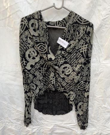 Long-sleeved black and white patterned top