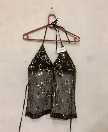 Haut halter transparent noir avec des paillettes en feuilles d'or et d'argent.